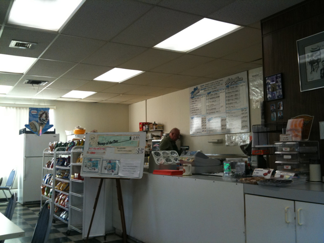 Issa Behind the Counter at Nellie's Deli